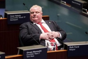 El alcalde de Toronto Rob Ford ocupa un asiento de la casa consistorial mientras los concejales votan mociones para limitar sus facultades el lunes 18 de noviembre de 2013 en Toronto. (Foto AP/The Canadian Press, Chris Young)
