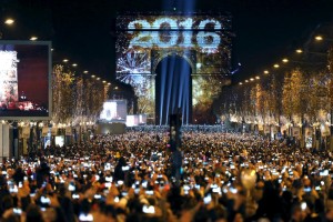 Revelers gather near the Arc de Triomphe on the Champs Elysees Avenue in Paris, France, during New Year celebrations, early January 1, 2016. REUTERS/Charles Platiau