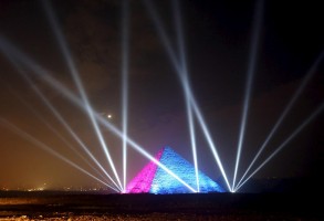 Egyptians celebrate in front of great pyramids during New Year's day celebrations on the outskirts of Cairo, Egypt, January 1, 2016. REUTERS/Mohamed Abd El Ghany
