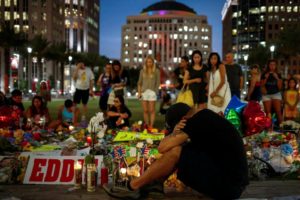 Local resident Jean Dasilva mourns for his deceased friend Javier Jorge-Reyes at a makeshift memorial in Downtown for victims of the gay night club shooting in Orlando, Florida, June 14, 2016. REUTERS/Adrees Latif