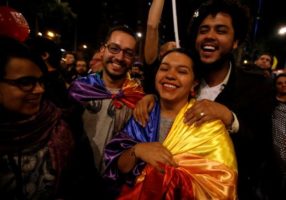 People celebrate after Colombia's government and Revolutionary Armed Forces of Colombia (FARC) rebels reached a final peace deal on Wednesday to end a five-decade war, in Bogota, Colombia, August 24, 2016. REUTERS/John Vizcaino
