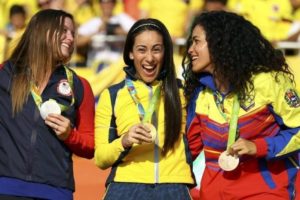 2016 Rio Olympics - Cycling BMX - Victory Ceremony - Women's BMX Victory Ceremony - Olympic BMX Centre - Rio de Janeiro, Brazil - 19/08/2016. Gold medalist Mariana Pajon (COL) of Colombia, silver medalist Alise Post (USA) of USA and bronze medalist Stefany Hernandez (VEN) of Venezuela pose on the podium. REUTERS/Paul Hanna