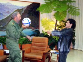 Cuban President Fidel Castro and Argentine soccer legend Diego Maradona play with a ball during an interview in La Havana, October 26, 2005. Maradona was in Havana to interview Castro for his weekly television show in Argentina, to be aired tonight, and promised President Castro he would be at the front of an anti-Bush march in Argentina next week. REUTERS/Canal 13